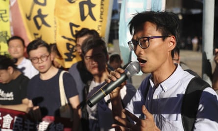 Eddie Chu and followers demonstrate against the arrest of 26 people opposed to the Chinese government.