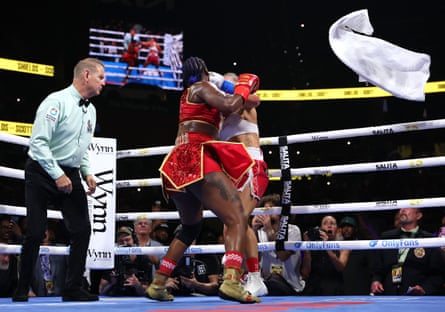 A towel flies in from the corner of Kaye Scott as Claressa Shields pummels away during the sixth round.