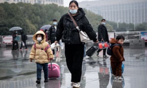A woman with her kids walk in snowfall at the Hankou Railway Station in Wuhan. A total of 2.8bn passenger trips are expected during the 40-day ‘Chunyun,’ or Spring Festival travel rush, which started from January 17 this year. Millions of Chinese will travel home to visit families in mass during the Spring Festival holiday period that begins with the Lunar New Year on 1 February.