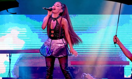 Ariana Grande performs on stage