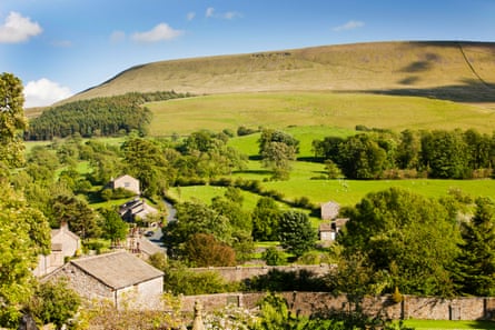 The village of Downham, nestling beneath Pendle Hill in the Ribble Valley, Lancashire, UK.