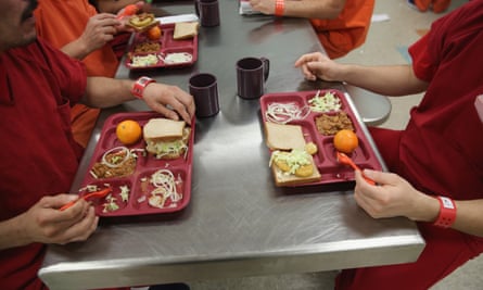 Detainees eat lunch at the Adelanto facility in 2013. Critics fear the private prison company Geo is manipulating local officials.