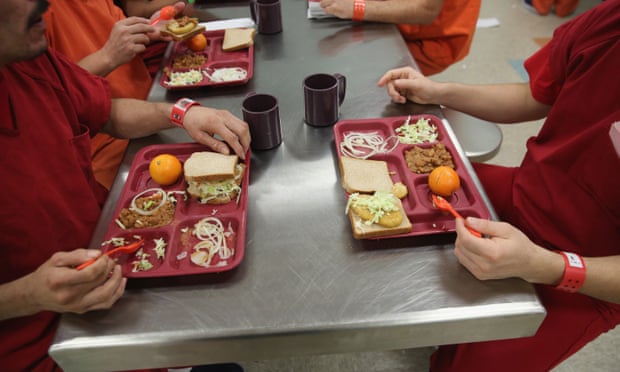 Immigrant detainees eat lunch at the Adelanto detention facility in 2013 in Adelanto, California.
