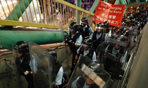 hong kong policeman on a bridge