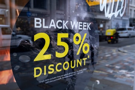 Black Friday advertising poster offering 25% discounts on a shop window in London