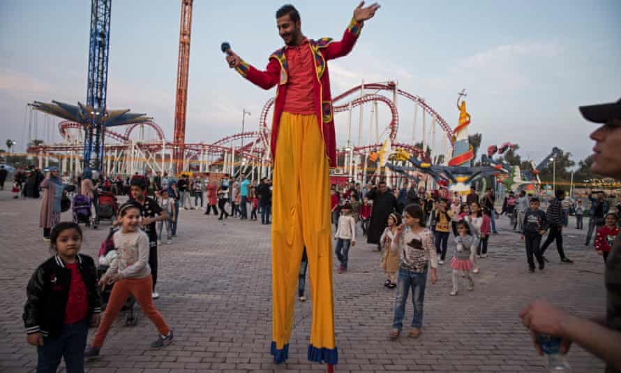 Stilt-walker Muhammed Samir puts on a show once a week at Zawra park.