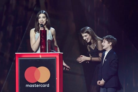 Lipa with her younger siblings at the Brit awards.