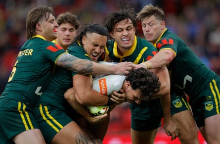 Herbie Farnworth of England cannot find a way through four Australian defenders during the first Test at Wembley.