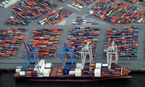 A container ship is loaded at a terminal in the harbour of Hamburg, Germany