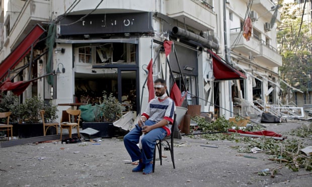 An injured man amid the wreckage in Beirut’s Mar Mikhaël neighbourhood