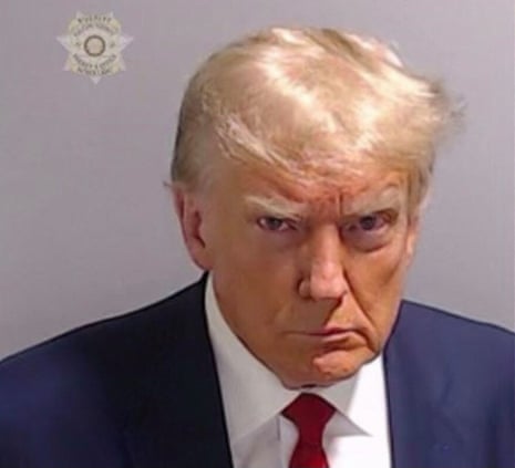 ‘He’s no Cindy Sherman’ … the booking photo of Trump, taken after his arrest in Fulton.