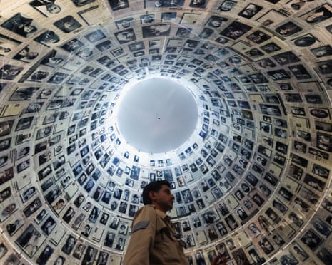A visitor looks at an exhibition ahead of Israel’s national Holocaust memorial day at Yad Vashem, the World Holocaust Remembrance Centre, in Jerusalem