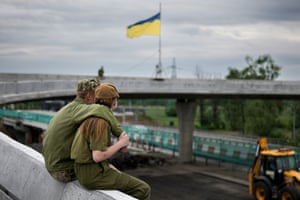 Kyiv, Ukraine Two Ukrainian soldiers enjoy a tender off-duty moment near the village of Stoyanka