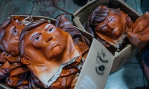 Masks of Donald Trump are seen in boxes at the Shenzhen Lanbingcai Latex Crafts Factory, which produces Halloween costumes and masks, in Shenzhen, China.