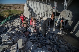 Children on the rubble of a building in the Jarabulus district. Families who returned to their homes in Jarabulus after its cleansing by Islamic State will try to rebuild their houses before winter