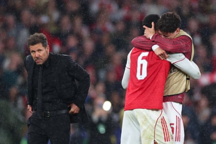 Diego Simeone (left) looks on amid Arsenal’s celebrations
