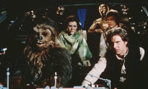 Peter Mayhew in costume as Chewbacca, left.