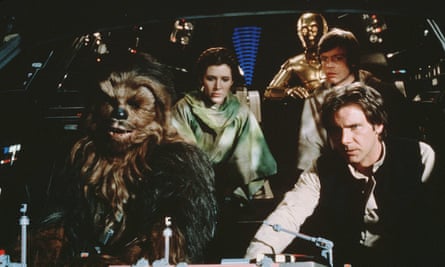 Peter Mayhew in costume as Chewbacca, left.