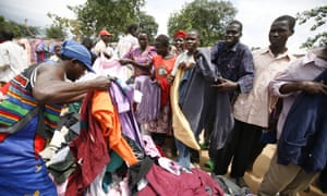 People buying clothes at the Katine market, a small village in north-east Uganda, Africa
