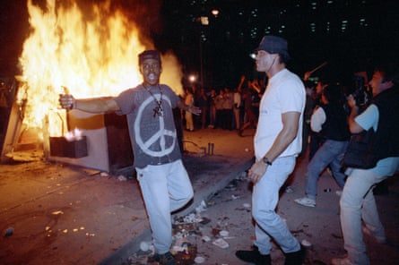 Demonstrators protest against the verdict in the Rodney King beating case in front of LAPD headquarters, on 29 April 1992.
