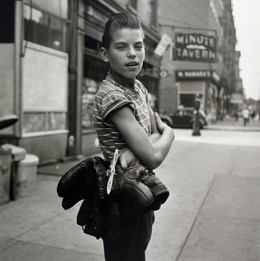A boy looks straight at the camera, New York, 1954.