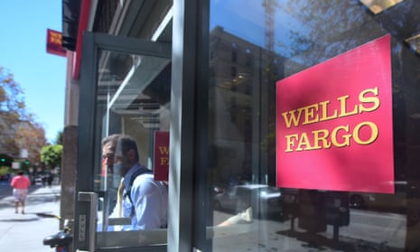 person walking out of a wells fargo bank