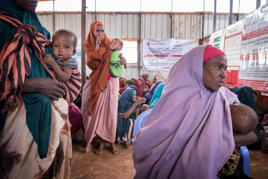 Garn and her two-year-old Marian at a health clinic run by Save The Children
