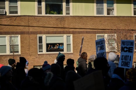 Children look on at people protesting