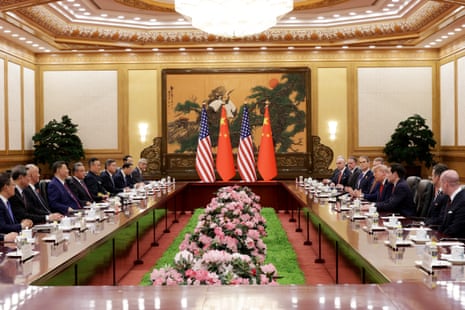 Donald Trump walks with Xi Jinping during a welcome ceremony at the Great Hall of the People.