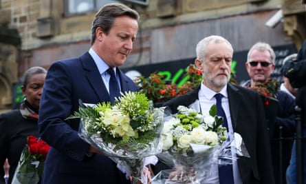 Prime minister David Cameron and Labour leader Jeremy Corbyn lay flowers at the scene where Jo Cox died.