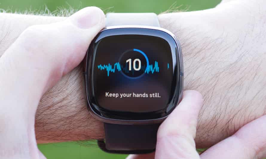 Fitbit Sense on wrist, showing ECG feature