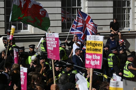 Police officers separate the supporters of the two demonstrations in London today.