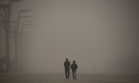 Visitors walk outside the National Stadium in Beijing<br>on 1 December 2015.