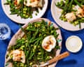 Plates laid out on a table with a blue tablecloth, with the mozzarella and green bean salad on top