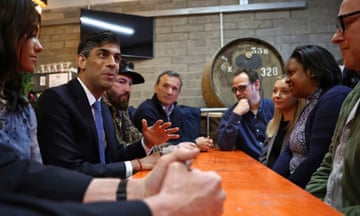 Rishi Sunak speaks with brewery workers during a visit to the Vale of Glamorgan Brewery in Barry, south Wales,