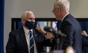 Chris Miller, acting defense secretary, right, greets Vice-president Mike Pence, left, on 18 December in Washington.