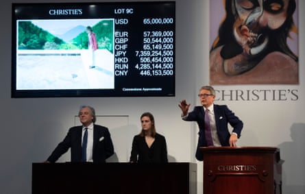 Auctioneers take bids for the painting at Christie’s auction house in New York.