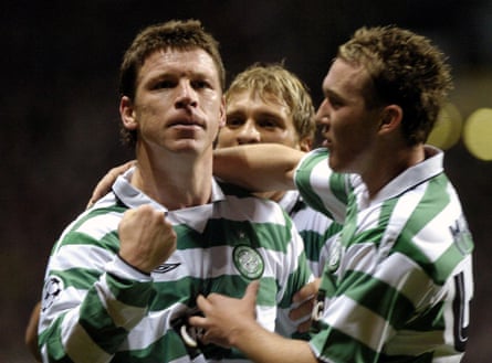 Alan Thompson holds up his fist arsenic different Celtics subordinate hugs him