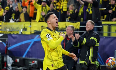 Borussia Dortmund’s Jadon Sancho celebrates after scoring his team’s opening goal against PSV