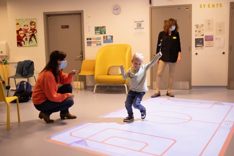 Health play specialists work with George. The specialists help children and young people understand their treatment