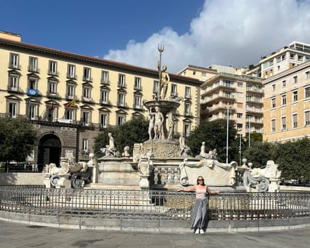 Katherine stands in front of a fountain in Piazza Municipio in Naples, Italy.