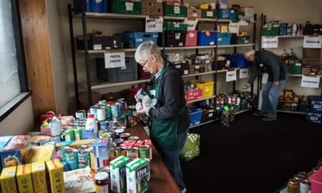 Volunteers prepare stock for food parcels at a food bank provided by the Trussell Trust