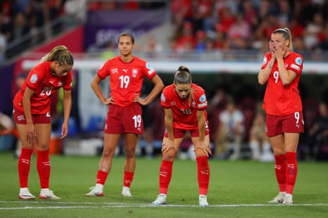 Players of Switzerland look dejected.