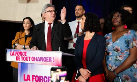 Jean-Luc Mélenchon gestures as he speaks at a lectern