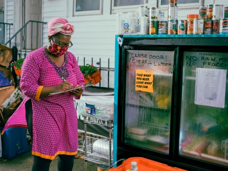 Tatiana Smith organizes the fridge outside her house in Jersey City.