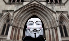 A member of Occupy London, wearing a Guy Fawkes mask, outside the High Court in London, January 18, 2012