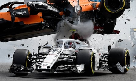 Fernando Alonso’s McLaren flies over Charles Leclerc’s Sauber at Spa. Alonso’s car left black marks on Leclerc’s halo safety device.