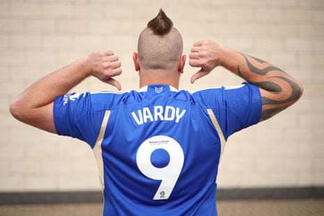 a man in a vardy shirt with mohawk haircut 
