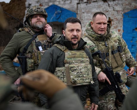 President Volodymyr Zelenskyy, centre, during his visit to Zaporizhzhia region in February 2024