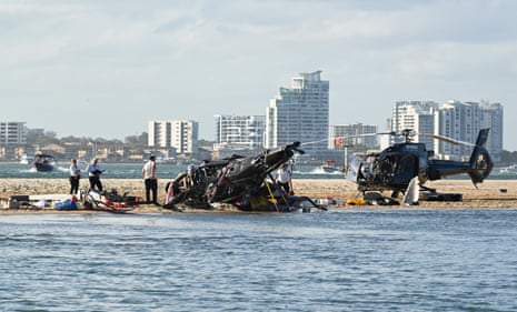 The wreckage of two helicopters after a collision near Seaworld on the Gold Coast.